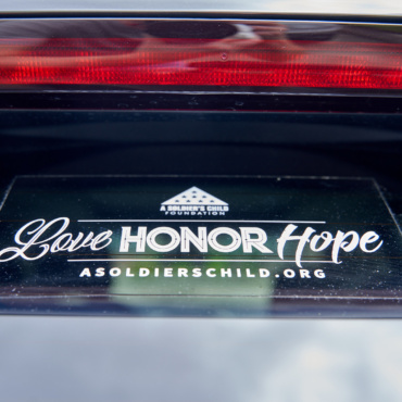 ASCF window cling with Love Honor Hope, logo, and website address in white.